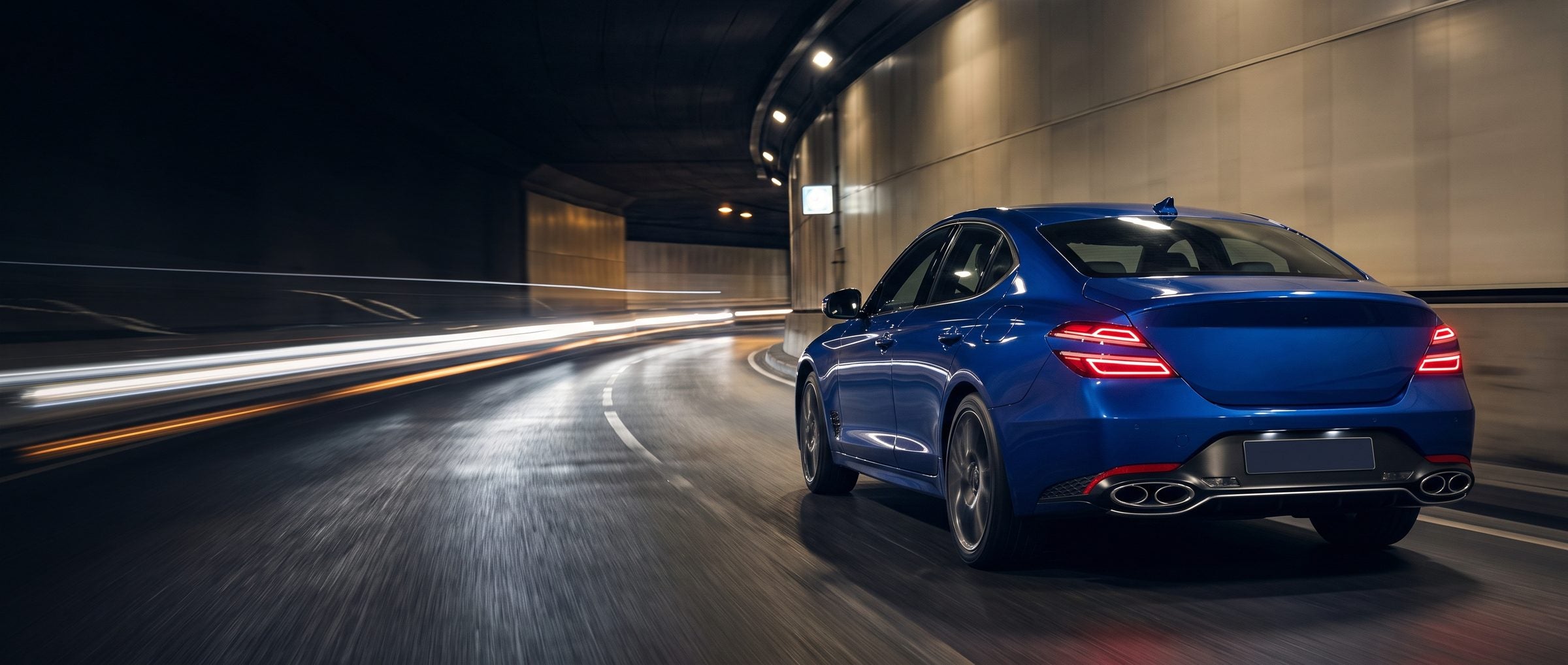 Blue sports saloon in a lit city tunnel