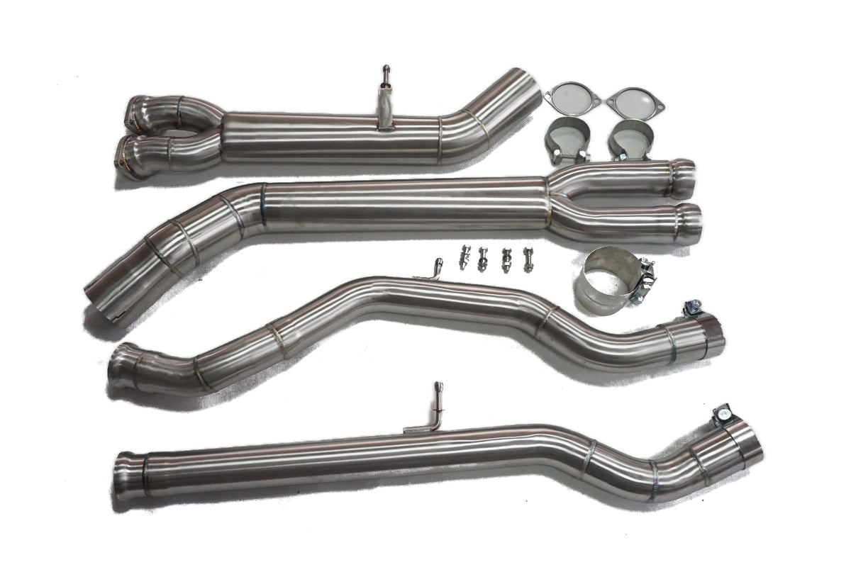 Four stainless steel midpipe sections with gaskets, clamps and bolts on a white background