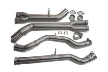 Four stainless steel midpipe sections with gaskets, clamps and bolts on a white background