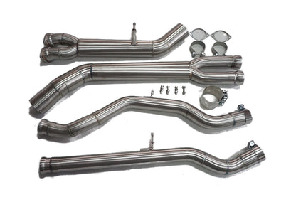 Four stainless steel midpipe sections with gaskets, clamps and bolts on a white background