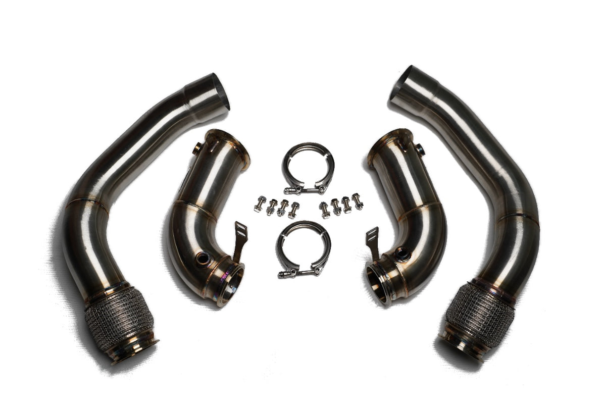 Two pairs of stainless steel downpipes with braided flex sections, V-band clamps and bolts on a white background